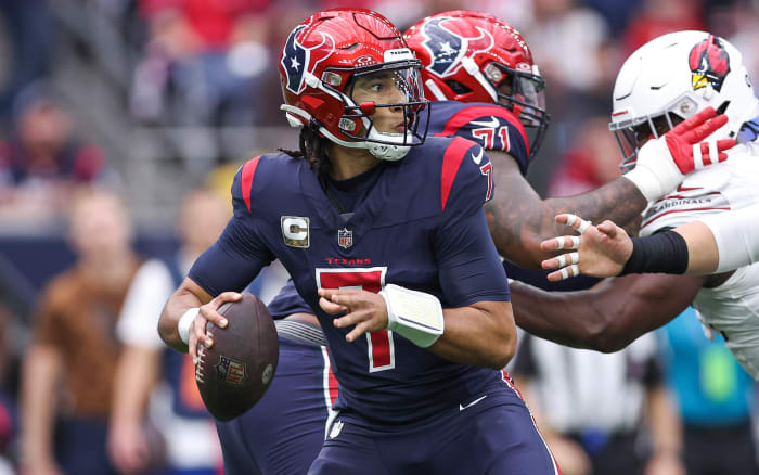 Nov 19, 2023; Houston, Texas, USA; Houston Texans quarterback C.J. Stroud (7) looks for an open receiver during the game against the Arizona Cardinals at NRG Stadium. Mandatory Credit: Troy Taormina-USA TODAY Sports